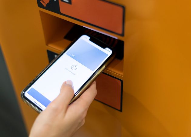 Person Paying with Its Smartphone Wallet App