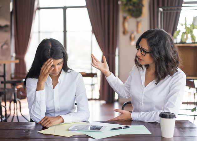 Disappointed Business Woman Scolding Colleague