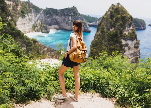 Back View Traveling Woman Standing Cliffs Tropical Beach
