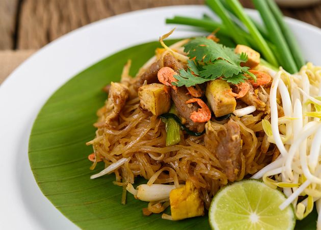 Pad Thai White Plate with Lemon Wooden Table
