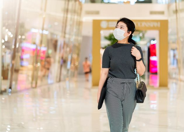 New Normal after Covid Epidemic Young Business Asian Female Wear Facial Protection Mask Walking Center Square Department Store Mall New Lifestyle after Spread Corona Virus Covid19