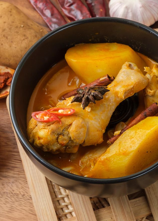 Massaman Curry with Chicken Thai Herbs with Wood Background Texture