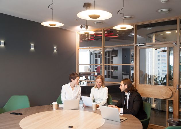 Businesspeople Having Discussion Team Meeting Modern Office Interior