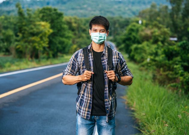 Male Tourists Wearing Mask Carrying Backpack Road