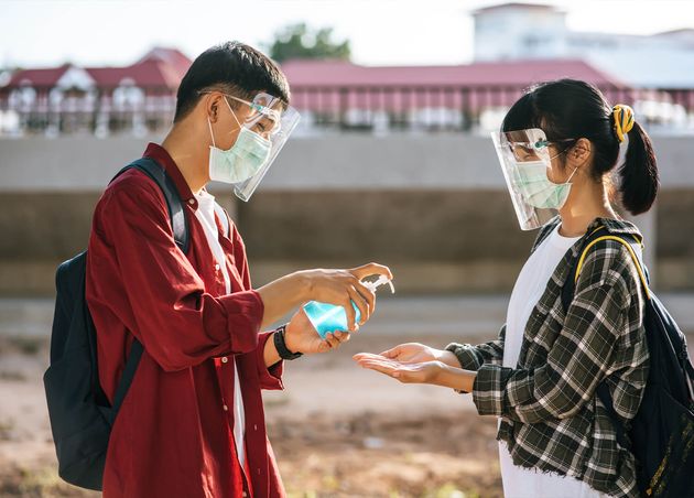 Male Female Students Wear Masks Squeeze Gel Wash Their Hands